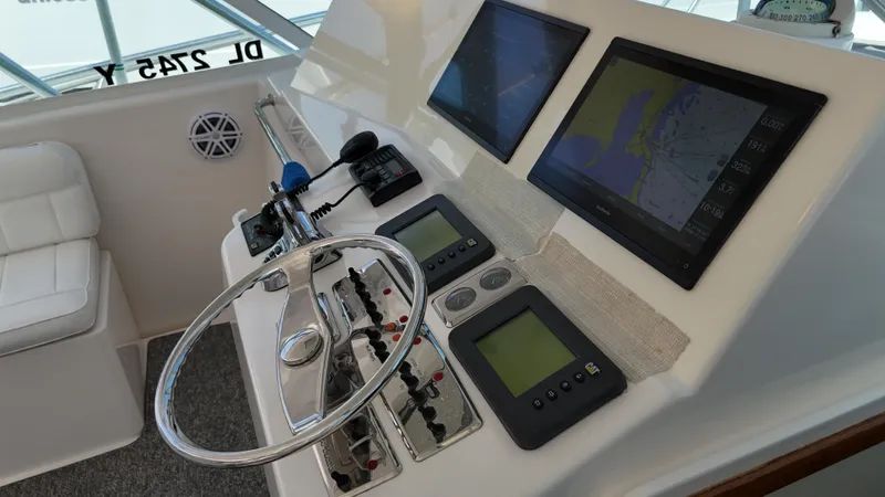 Siboney Yacht Photos Pics Cabo 40 Express 2004 helm with navigation systems.