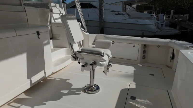 Siboney Yacht Photos Pics Cabo 40 Express 2004 with fishing chair in cockpit area.