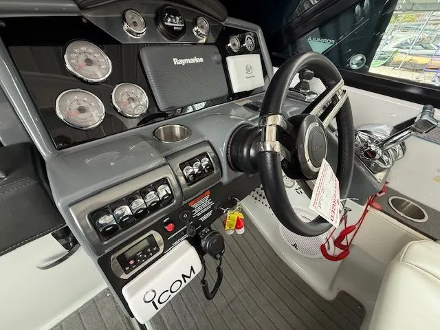 Stress Relief Yacht Photos Pics Dashboard of a 2013 Formula 350 Crossover Bowrider with steering wheel and instruments.