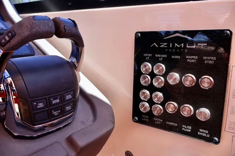  Yacht Photos Pics Control panel of a 2014 Azimut 38 yacht with various switches and throttle.