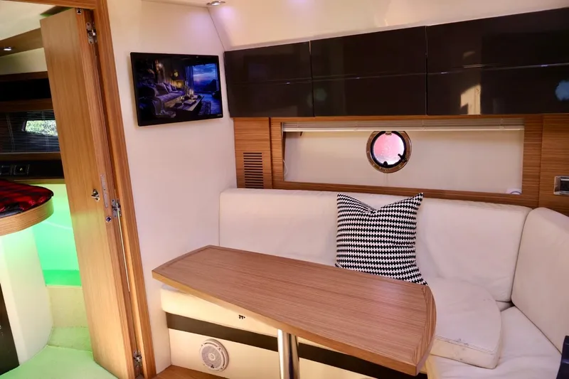  Yacht Photos Pics Luxurious interior of a 2014 Azimut 38 yacht with modern furnishings and a cozy seating area.