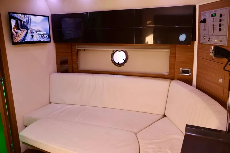  Yacht Photos Pics Luxurious interior of 2014 Azimut 38 yacht with white sofa and wall-mounted TV.