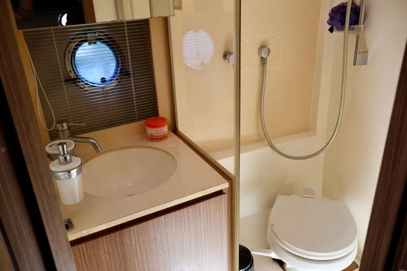  Yacht Photos Pics Bathroom interior of 2014 Azimut 38 yacht with sink, shower, and toilet.