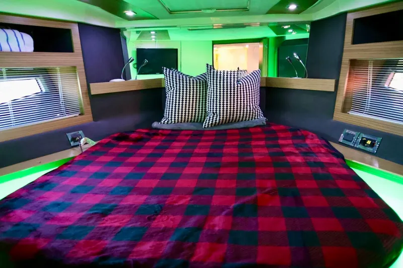  Yacht Photos Pics Luxurious cabin interior of 2014 Azimut 38 yacht with plaid bedding and modern lighting.