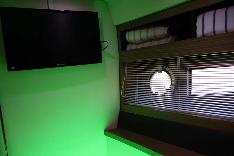  Yacht Photos Pics Interior of 2014 Azimut 38 yacht with TV, window blinds, and shelves.