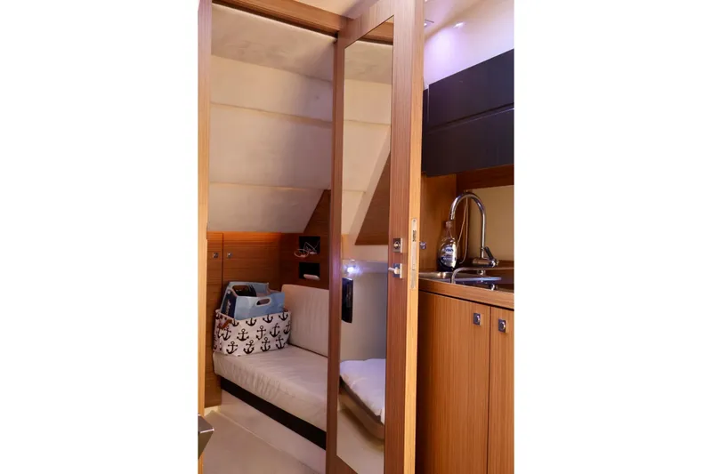  Yacht Photos Pics Luxurious interior of 2014 Azimut 38 yacht featuring cozy cabin and kitchenette.