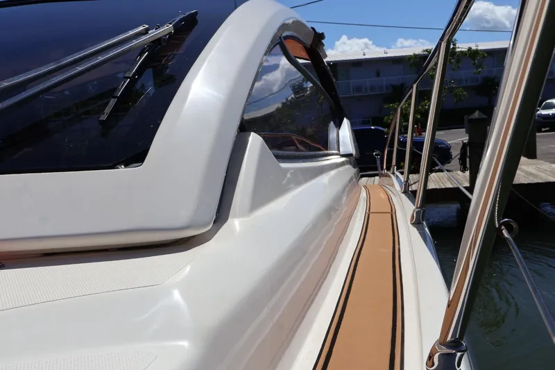  Yacht Photos Pics 2014 Azimut 38 yacht, sleek design, docked with polished railings and clear windows.