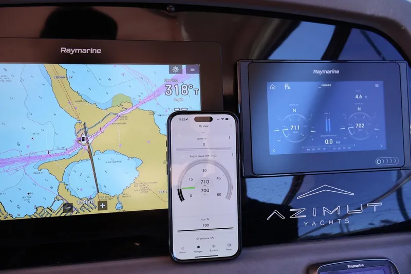  Yacht Photos Pics Navigation and engine displays on a 2014 Azimut 38 yacht dashboard.