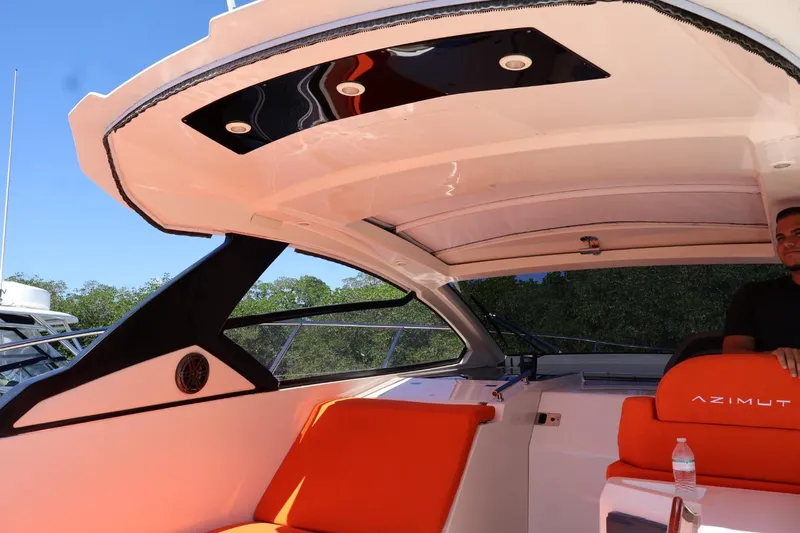  Yacht Photos Pics 2014 Azimut 38 yacht interior with orange seating and modern design elements.