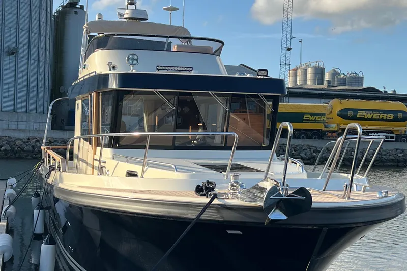  Yacht Photos Pics 2024 Targa 41 boat docked at a marina, showcasing sleek design and modern features.