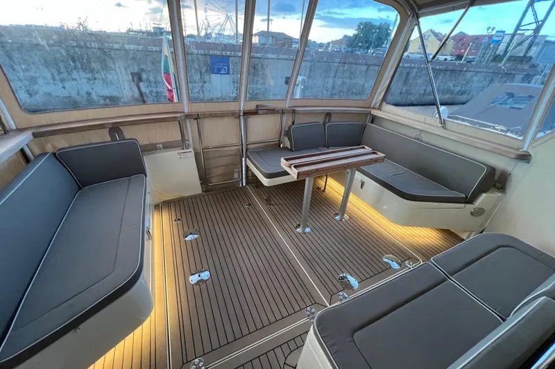  Yacht Photos Pics Luxurious interior of 2024 Targa 41 boat with elegant seating and wooden flooring.