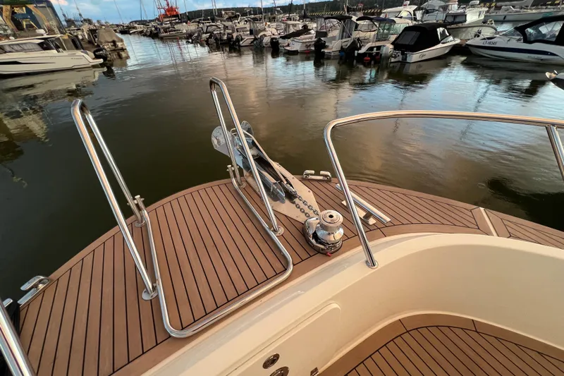  Yacht Photos Pics Bow of 2024 Targa 41 yacht in marina, featuring sleek deck and railing design.