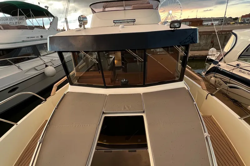  Yacht Photos Pics 2024 Targa 41 yacht docked at marina, showcasing sleek design and spacious deck.