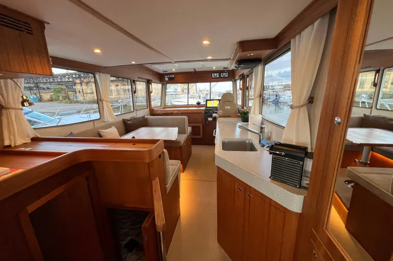  Yacht Photos Pics Luxurious interior of 2024 Targa 41 boat with modern amenities and elegant wood finishes.