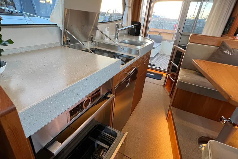  Yacht Photos Pics Modern kitchen interior of 2024 Targa 41 yacht with sleek countertops and appliances.