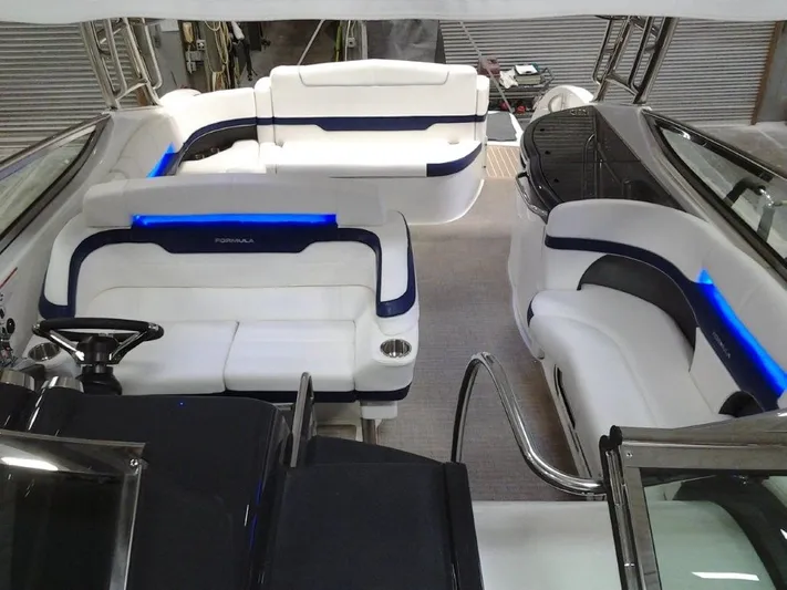 Lucky Yacht Photos Pics Interior of a 2018 Formula 370 Super Sport boat with white seating.