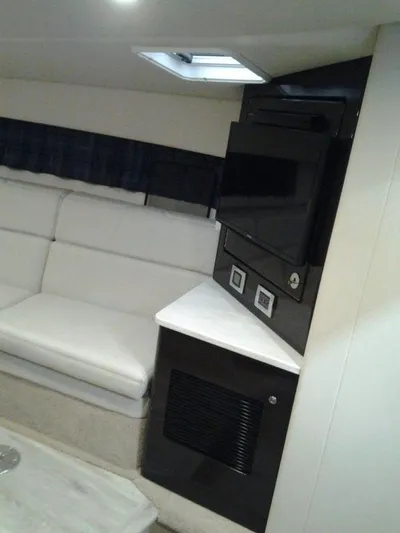 Lucky Yacht Photos Pics Interior of 2018 Formula 370 Super Sport yacht with sofa and TV.