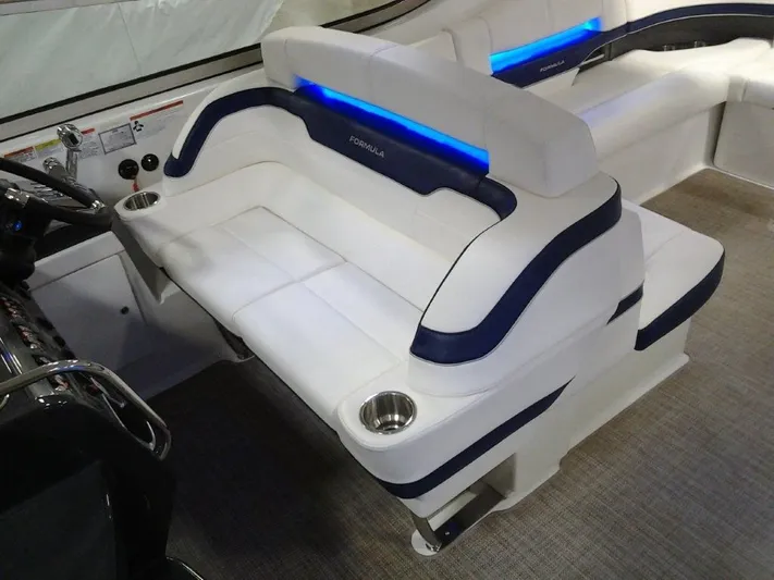 Lucky Yacht Photos Pics Interior of a 2018 Formula 370 Super Sport boat with blue lighting.