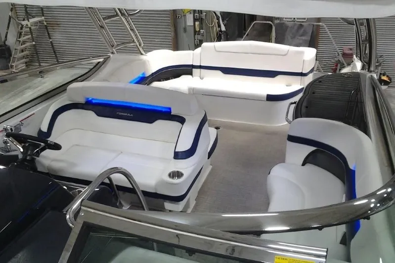 Lucky Yacht Photos Pics Interior of a 2018 Formula 370 Super Sport boat with white seating.