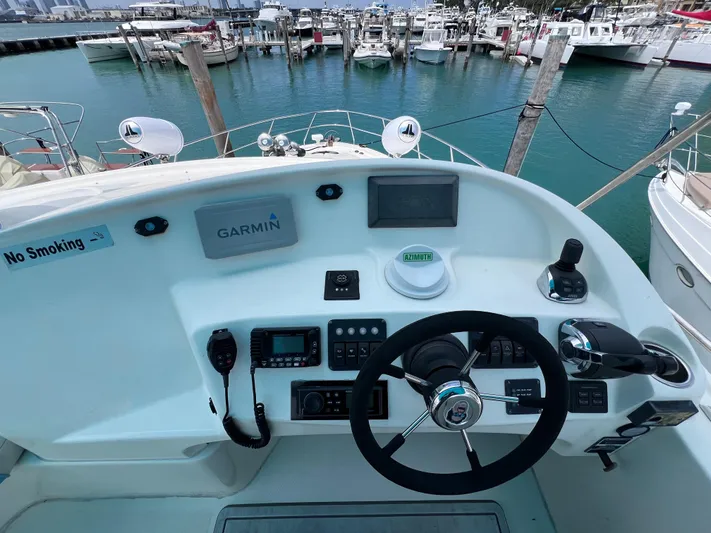  Yacht Photos Pics Cockpit of 2015 Silverton 43 Sport Bridge yacht with Garmin navigation system at marina.