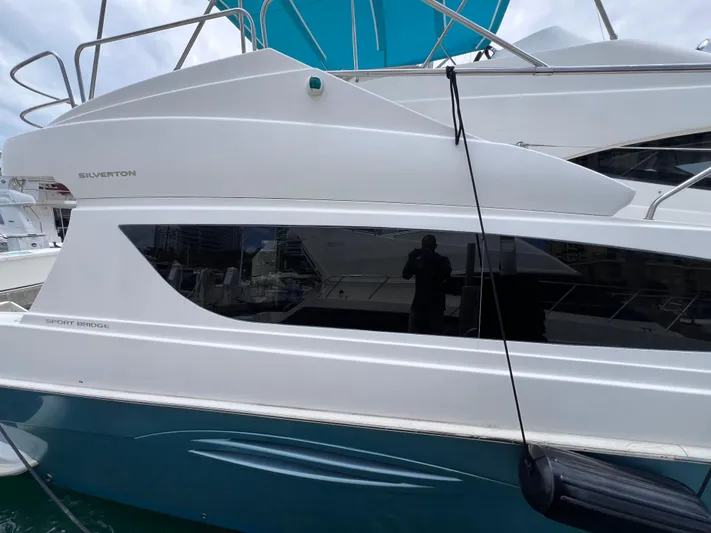  Yacht Photos Pics 2015 Silverton 43 Sport Bridge yacht with sleek design and modern features.