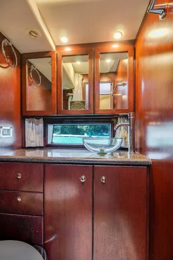  Yacht Photos Pics Luxurious interior of 2015 Silverton 43 Sport Bridge yacht with elegant wood cabinetry.