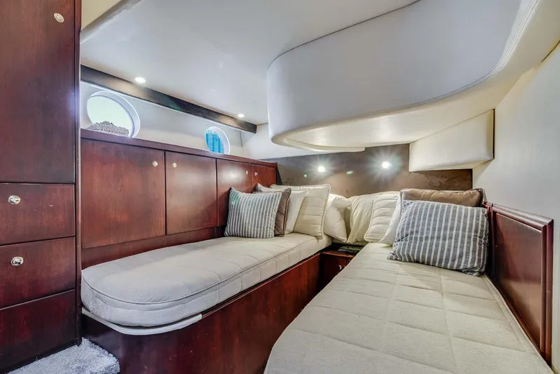  Yacht Photos Pics 2015 Silverton 43 Sport Bridge cabin with cozy beds and elegant wood finish.