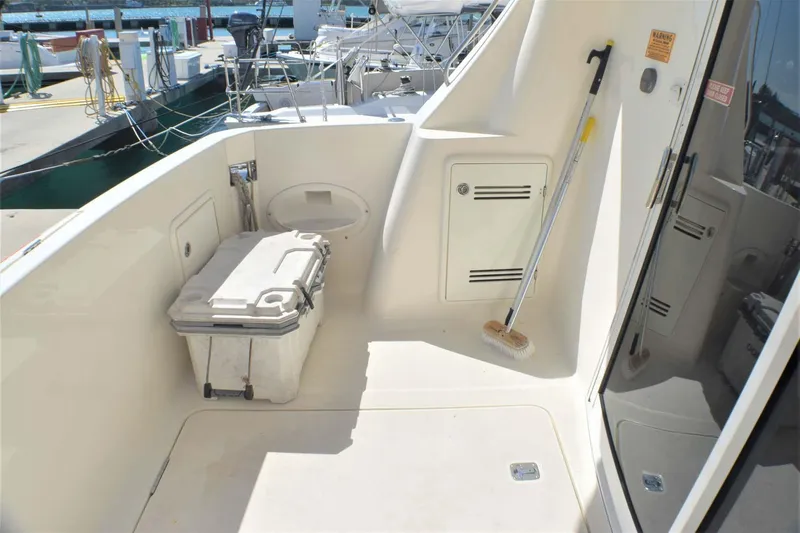  Yacht Photos Pics 2015 Silverton 43 Sport Bridge deck with storage and cleaning tools.