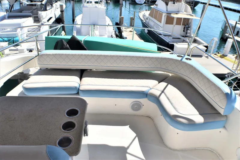 Yacht Photos Pics 2015 Silverton 43 Sport Bridge yacht with spacious seating area at marina.