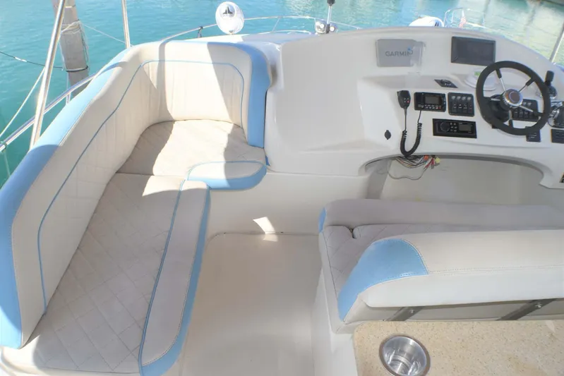  Yacht Photos Pics 2015 Silverton 43 Sport Bridge cockpit with plush seating and modern controls.