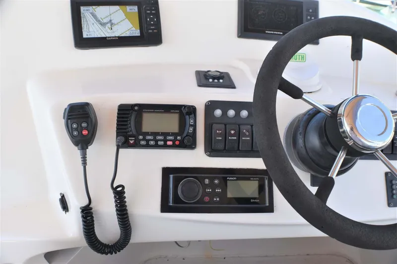  Yacht Photos Pics Helm of 2015 Silverton 43 Sport Bridge with navigation and communication equipment.