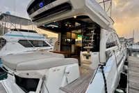 2017 Cranchi E 52 F yacht docked at marina, showcasing luxurious deck and interior.