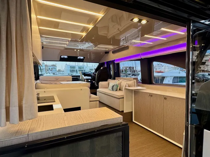  Yacht Photos Pics Luxurious interior of a 2017 Cranchi E 52 F yacht with modern lighting and elegant furnishings.