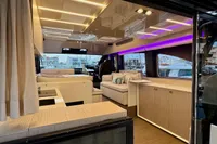 Luxurious interior of a 2017 Cranchi E 52 F yacht with modern lighting and elegant furnishings.