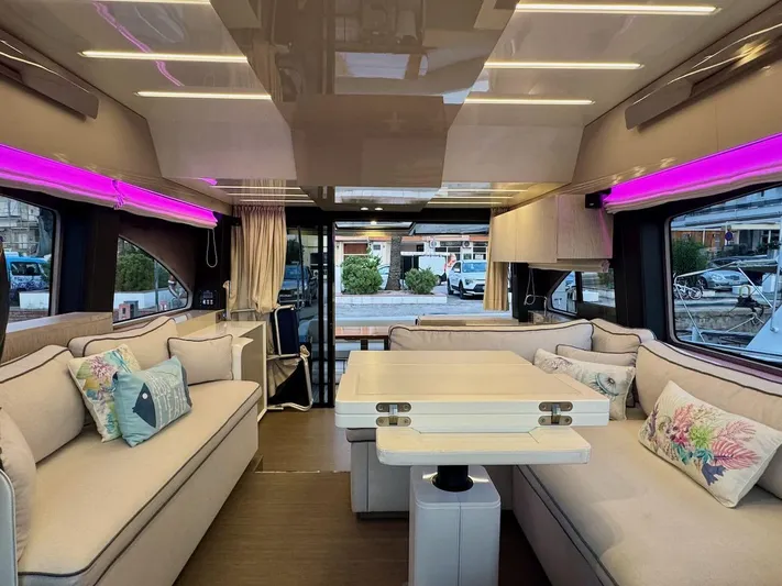  Yacht Photos Pics Luxurious interior of 2017 Cranchi E 52 F yacht with modern seating and ambient lighting.