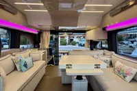 Luxurious interior of 2017 Cranchi E 52 F yacht with modern seating and ambient lighting.