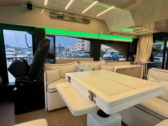  Yacht Photos Pics Luxurious interior of 2017 Cranchi E 52 F yacht with modern seating and ambient lighting.