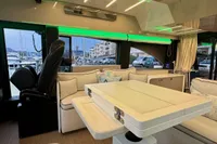 Luxurious interior of 2017 Cranchi E 52 F yacht with modern seating and ambient lighting.