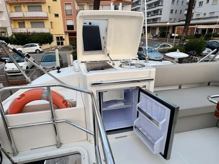  Yacht Photos Pics Outdoor kitchen on 2017 Cranchi E 52 F yacht with fridge and grill.