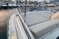 2017 Cranchi E 52 F yacht with spacious deck in marina setting.