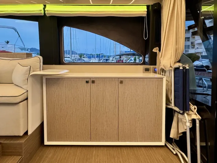  Yacht Photos Pics Interior of 2017 Cranchi E 52 F yacht with modern cabinetry and marina view.