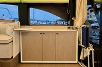 Interior of 2017 Cranchi E 52 F yacht with modern cabinetry and marina view.
