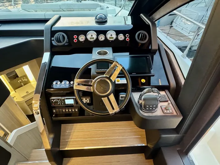  Yacht Photos Pics 2017 Cranchi E 52 F yacht helm with modern controls and sleek design.