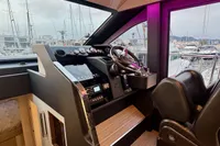 2017 Cranchi E 52 F yacht helm with modern controls and marina view.