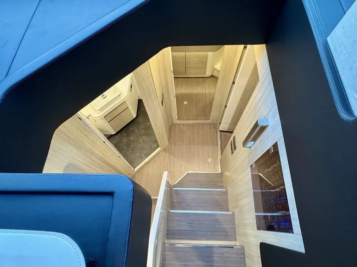  Yacht Photos Pics Interior view of 2017 Cranchi E 52 F yacht, featuring modern wooden stairs and sleek design.