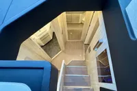 Interior view of 2017 Cranchi E 52 F yacht, featuring modern wooden stairs and sleek design.