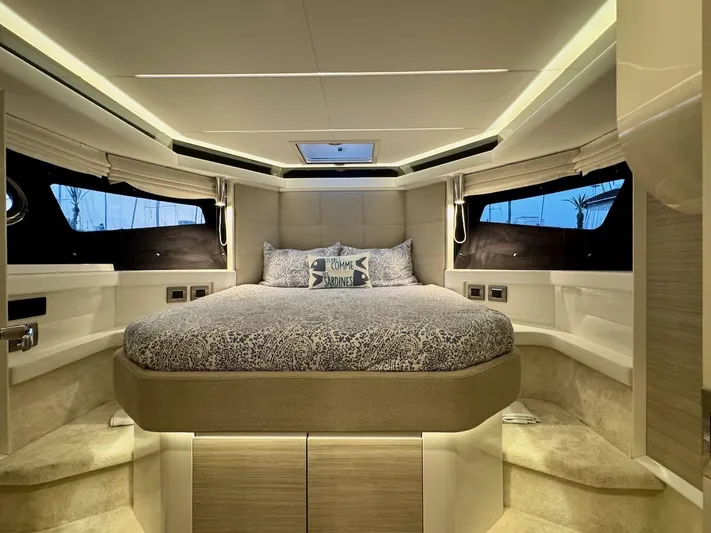  Yacht Photos Pics Luxurious bedroom interior of 2017 Cranchi E 52 F yacht with elegant bedding and ambient lighting.