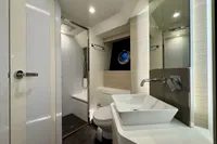 Luxurious bathroom interior of 2017 Cranchi E 52 F yacht with modern fixtures.