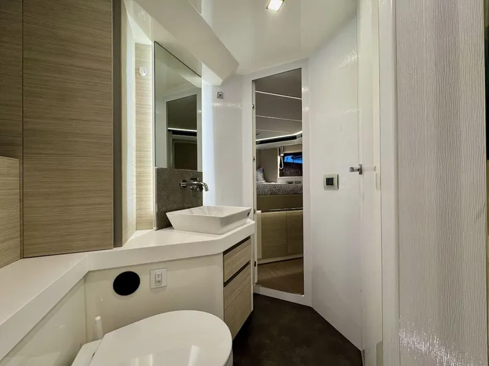  Yacht Photos Pics Modern bathroom interior of 2017 Cranchi E 52 F yacht, featuring sleek design and fixtures.