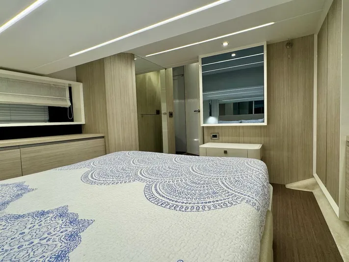  Yacht Photos Pics Luxurious bedroom interior of 2017 Cranchi E 52 F yacht with elegant decor.
